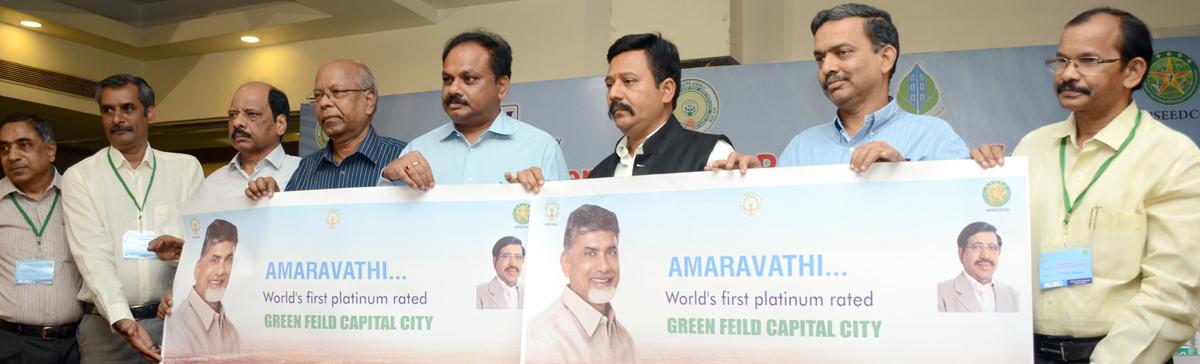 CRDA commissioner Ch Sreedhar,  CII chariman V Sudhakar Chowdary and others relesing a poster on Green Building Concepts in Vijayawada on Tuesday
