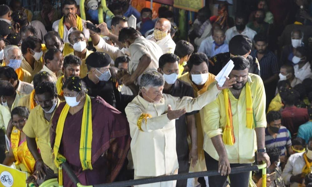 TDP chief N Chandrababu Naidu addressing a road show in Srikalahasti on Thursday. Party candidate Panabaka Lakshmi and Srikalahasti in-charge B Sudheer Reddy are also seen